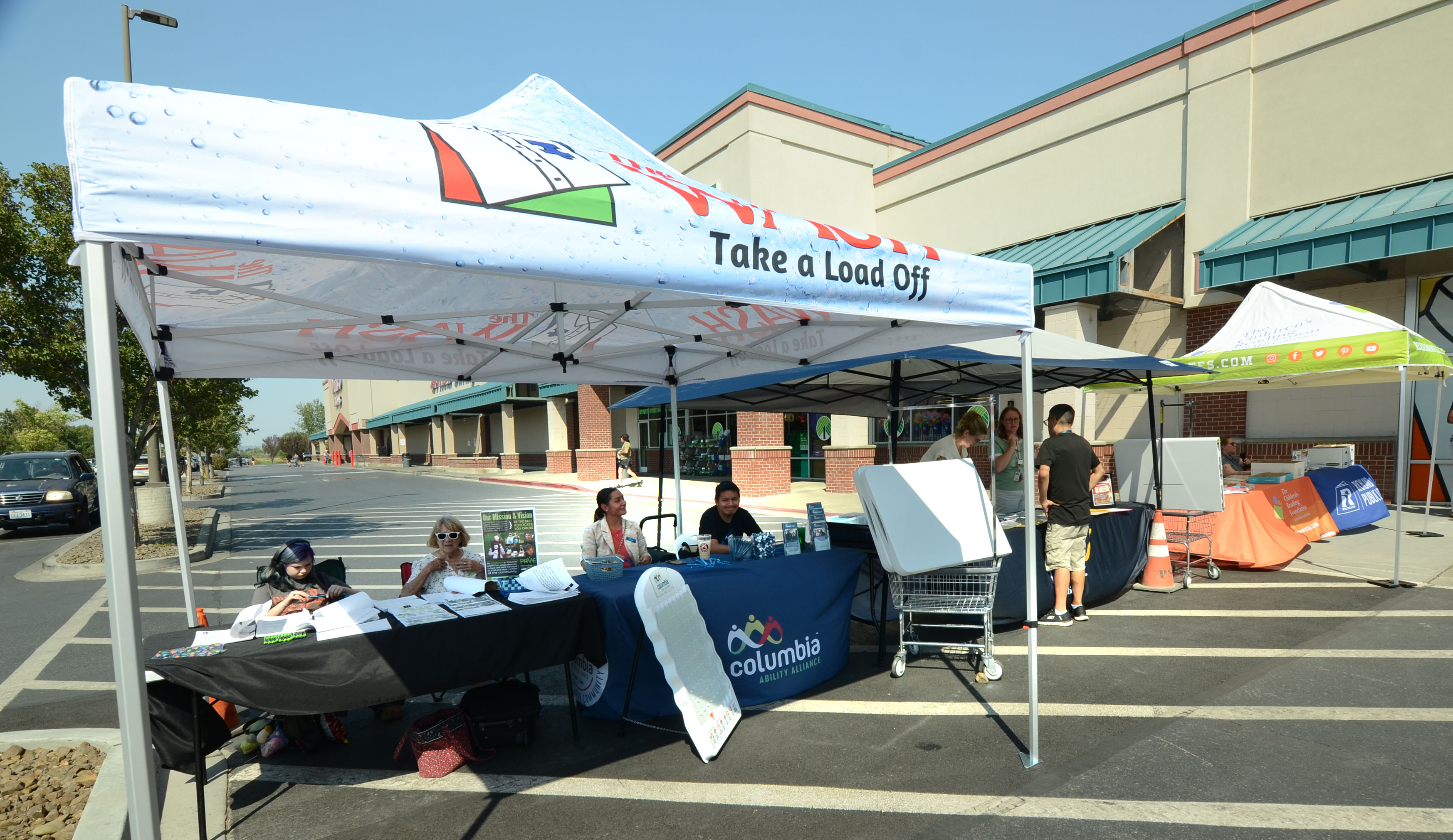 Resource tents outside The Wash during Free Laundry Day