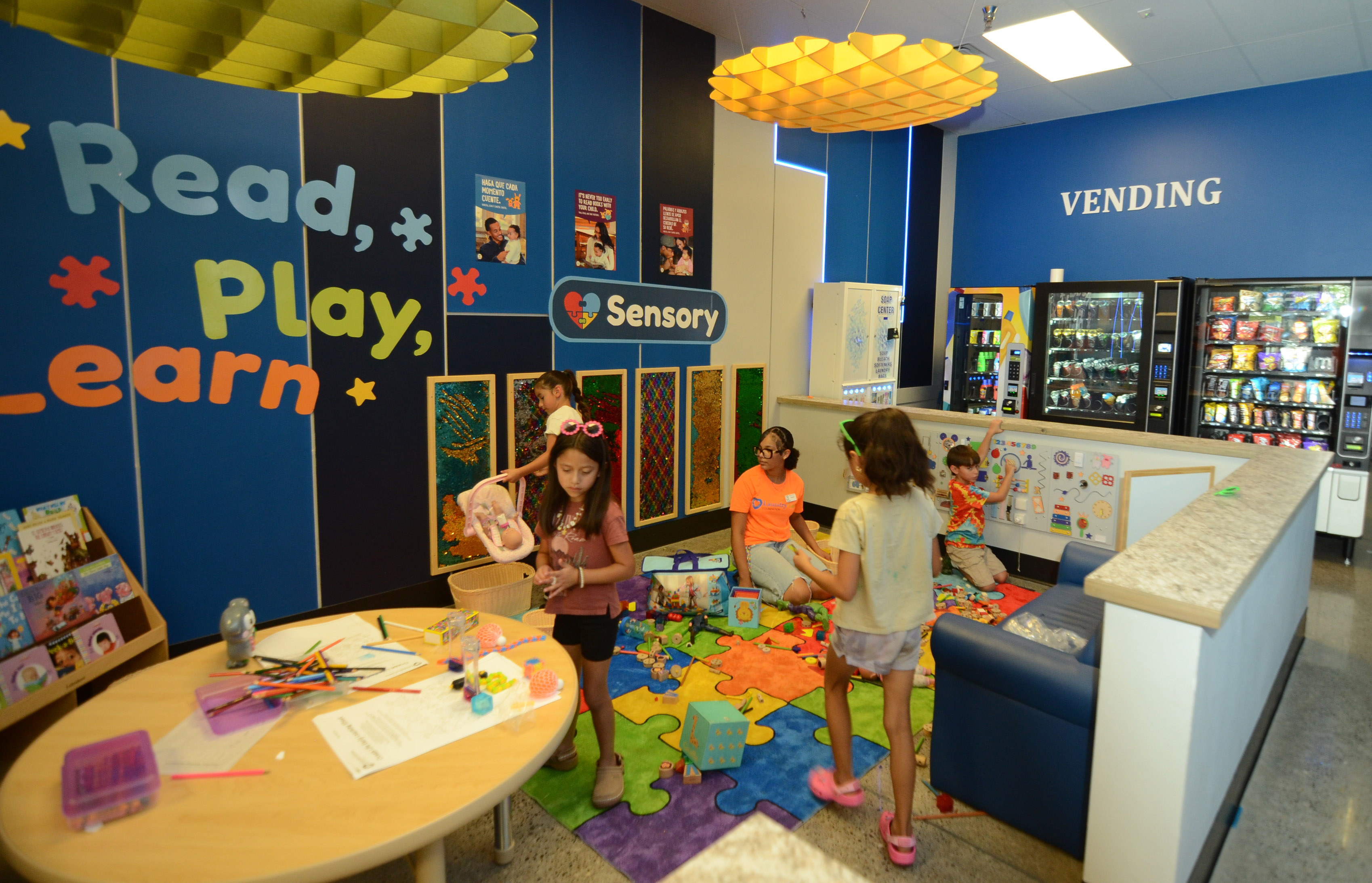 Children enjoying the colorful Read Play Learn activity corner