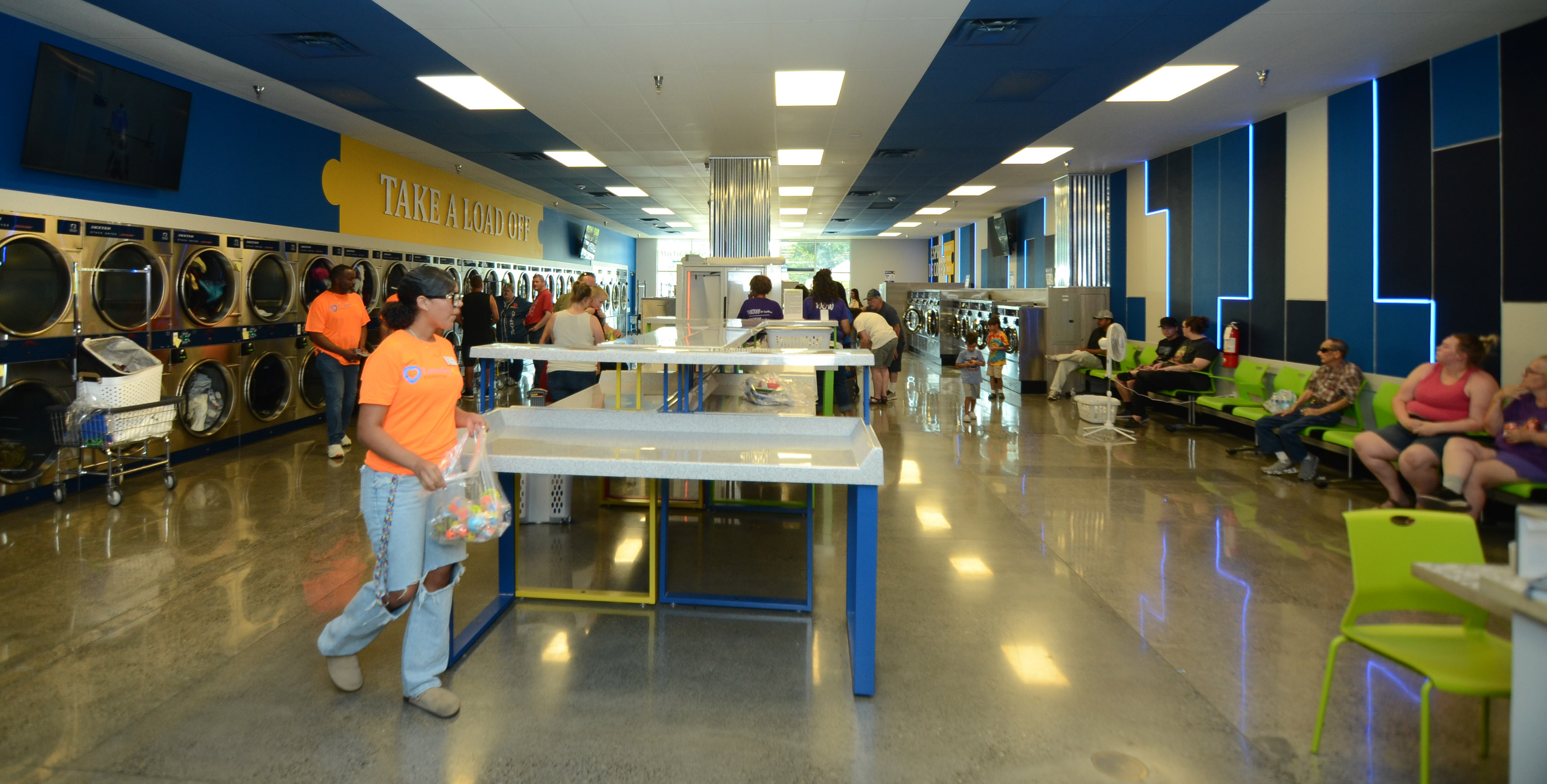 The Wash interior with folding tables and rows of machines