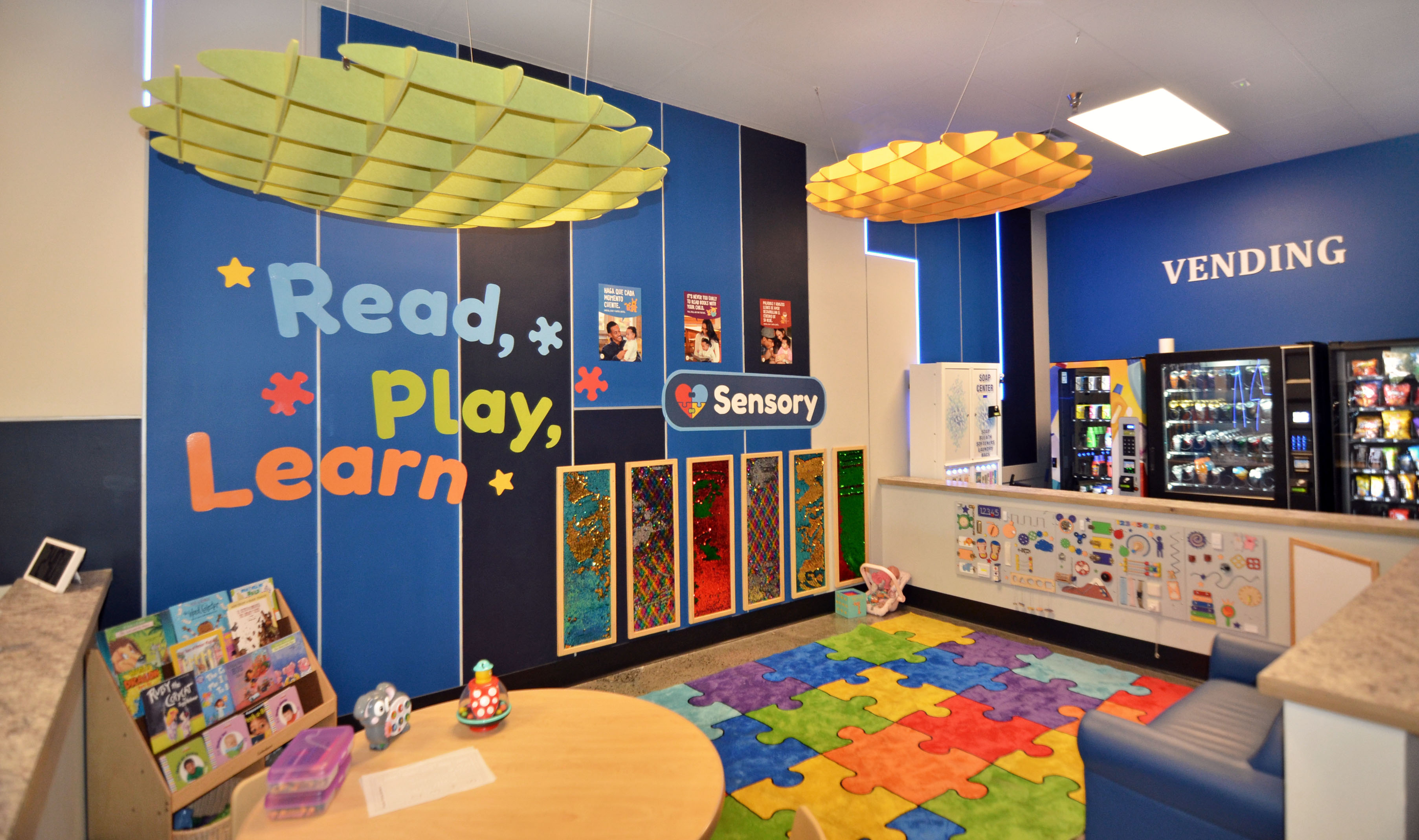 Vending machines beside the Read Play Learn corner at The Wash